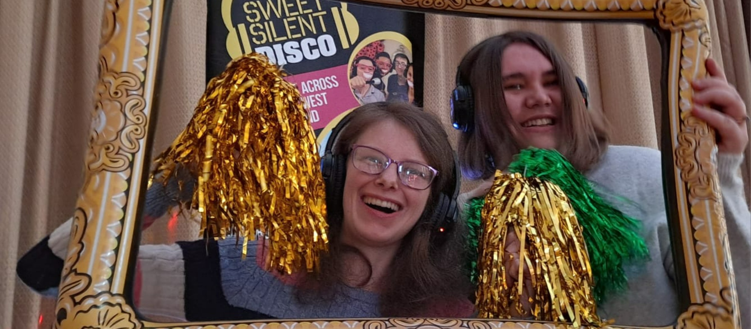 Friends at a charity event listening to a silent disco