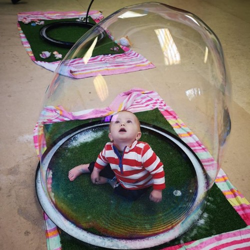 baby inside a bubble sensory play