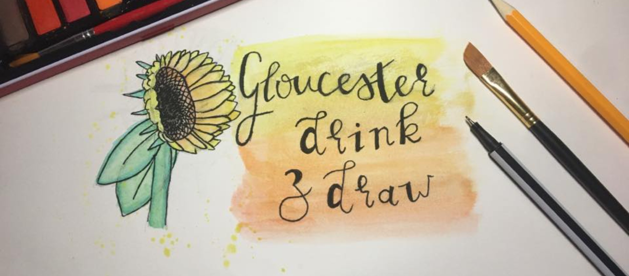 text 'Gloucester drink & draw' on sketch paper with pencil, pen and paintbrush