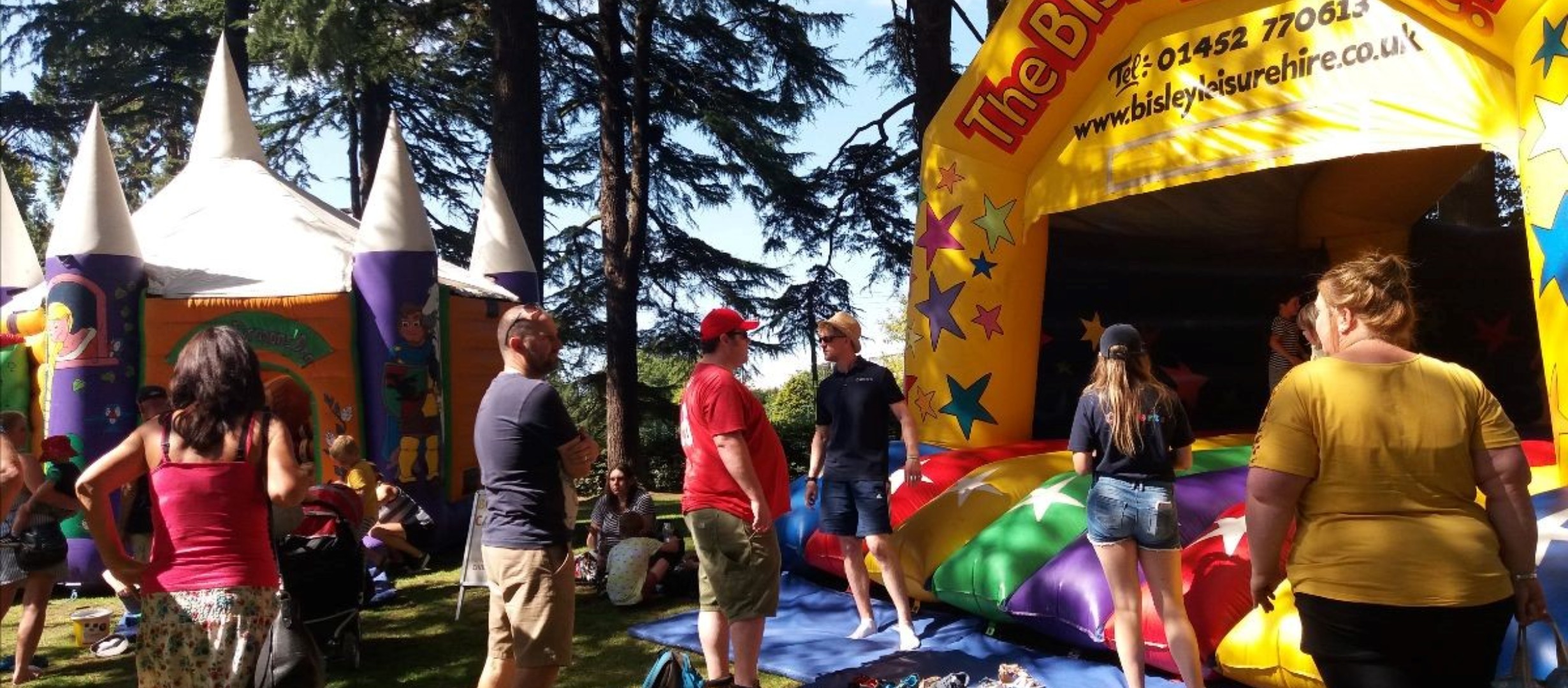 people around a bouncy castle