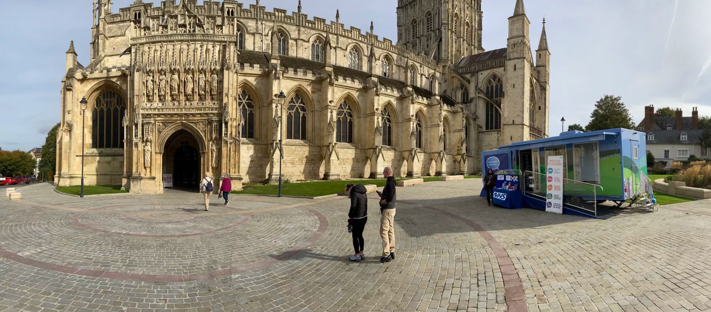 View of Gloucester Cathedral with the NHS bus parked outside
