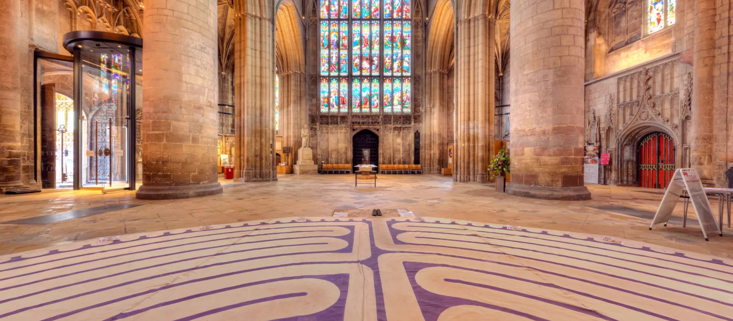 A view of the inside of Gloucester Cathedral with the Labyrinth laid out on the floor