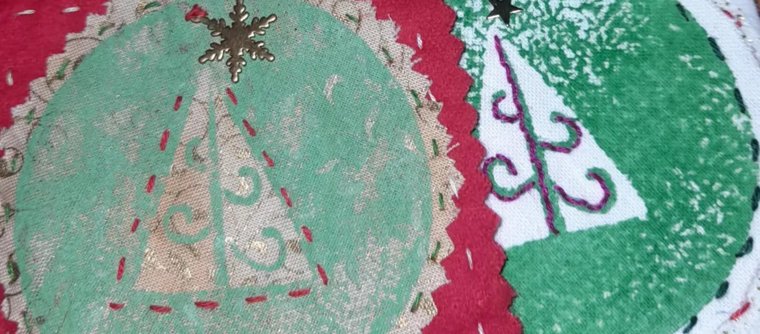 Close up of hand-made green and red textile Christmas decorations