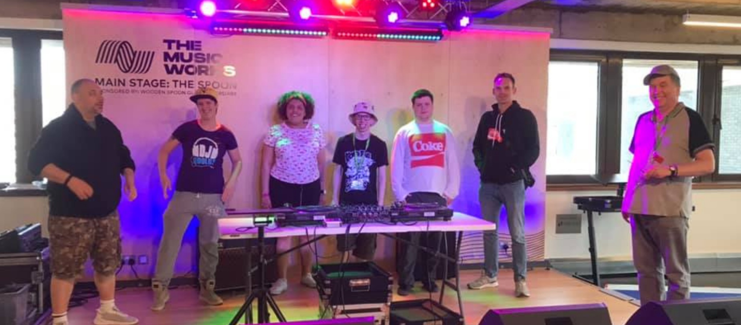 DJ Collective group photo on stage at The Music Works Hub in Gloucester 