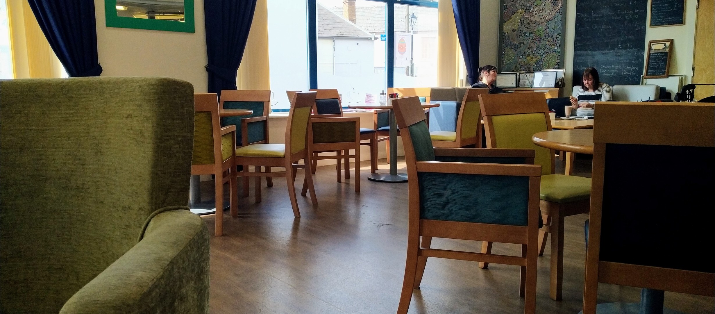 A picture of the inside of the cafe. Lino floors, easy to arrange chairs
