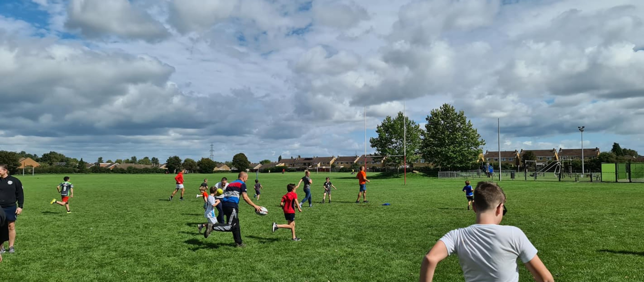 Example of tag style rugby game involving both children and parents