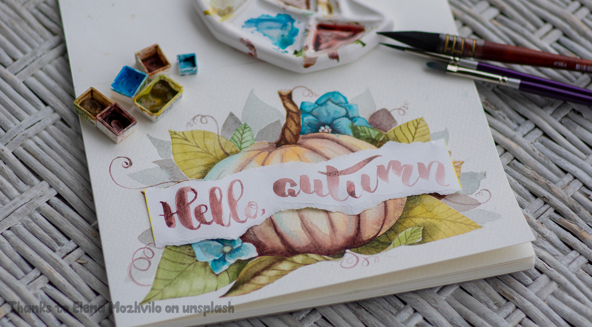 A beautiful painting of a watercolour pumpkin with hand written calligraphy which reads 