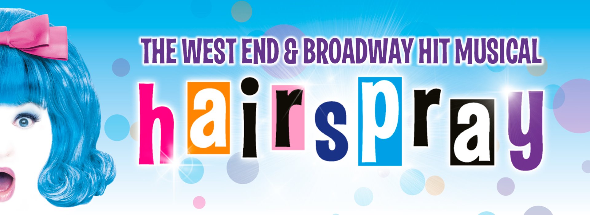 A shocked girl with the words 'The West End and Broadway Hit Musical Hairspray' to her right