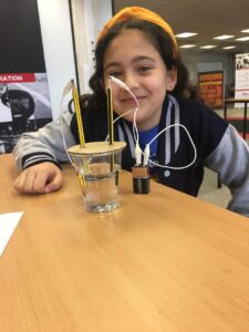 Girl making electricity experiment