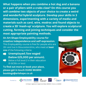 This is a photograph of a quirky sculpture with a red telephone and a courgette 