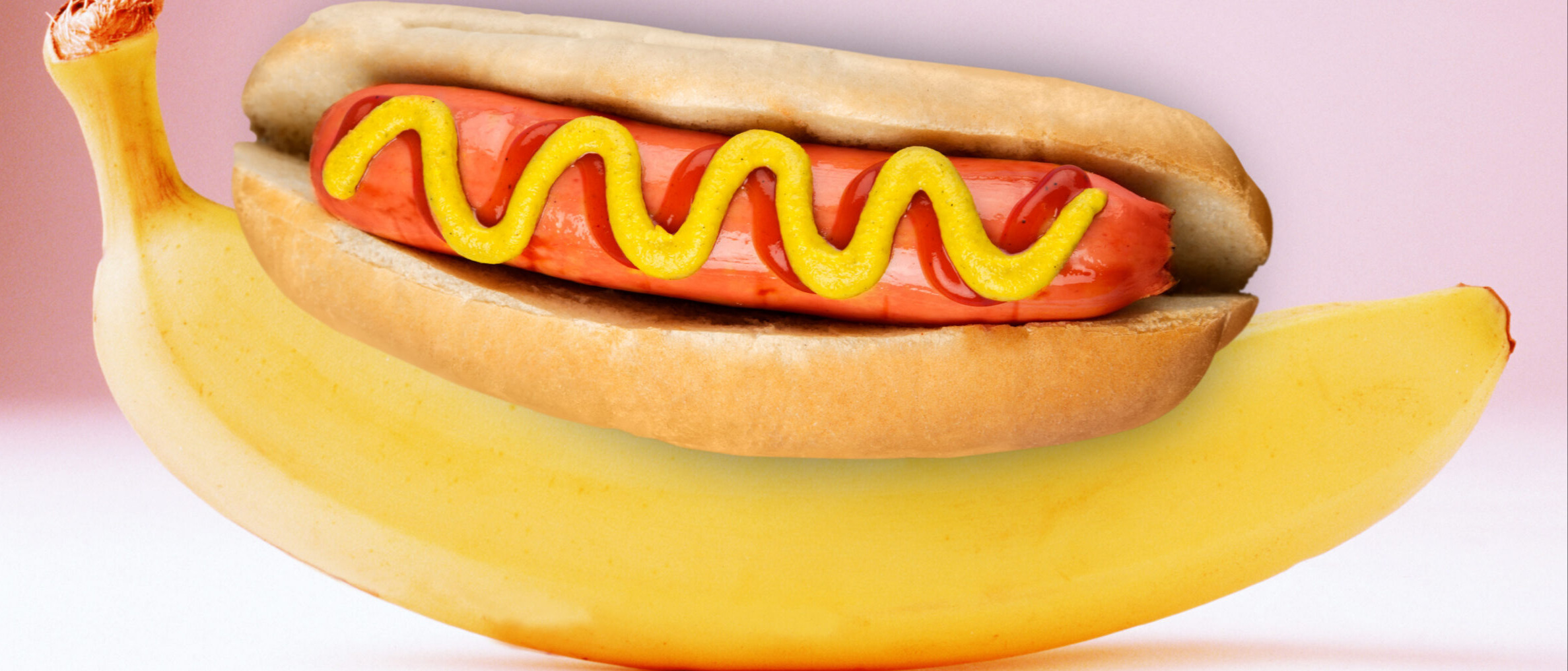 This is a quirky image of a hotdog ontop of a banana