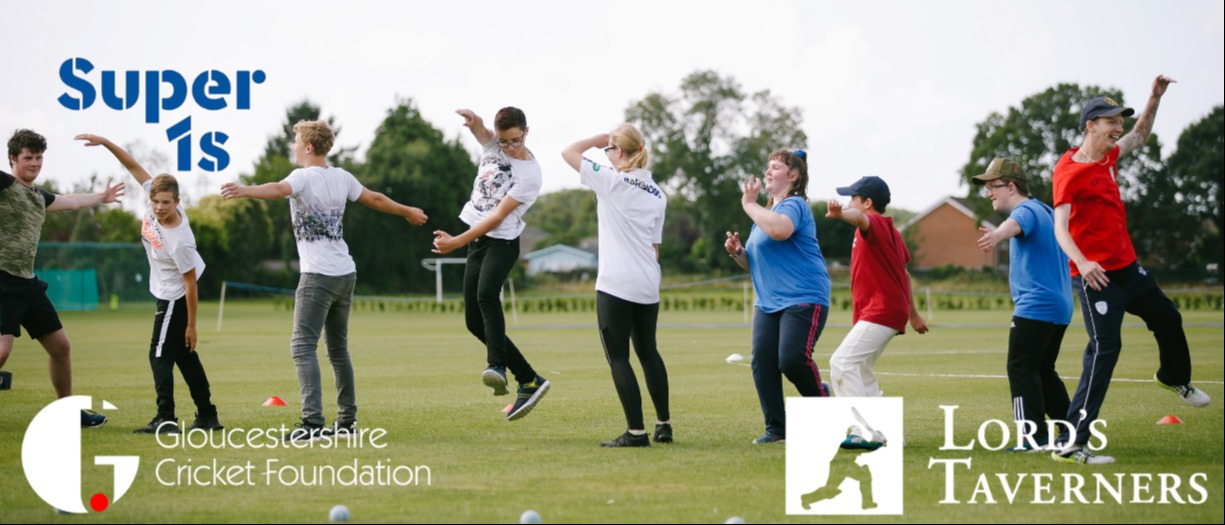 Line of cricket players jumping in air, wearing different coloured clothes