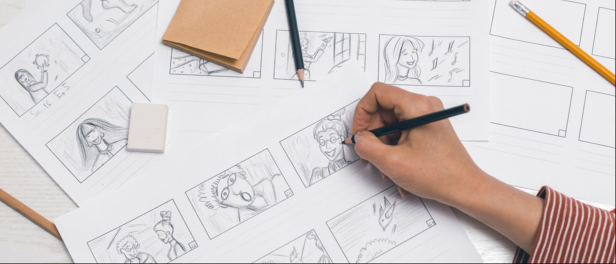 This is a photograph of a person creating a comic