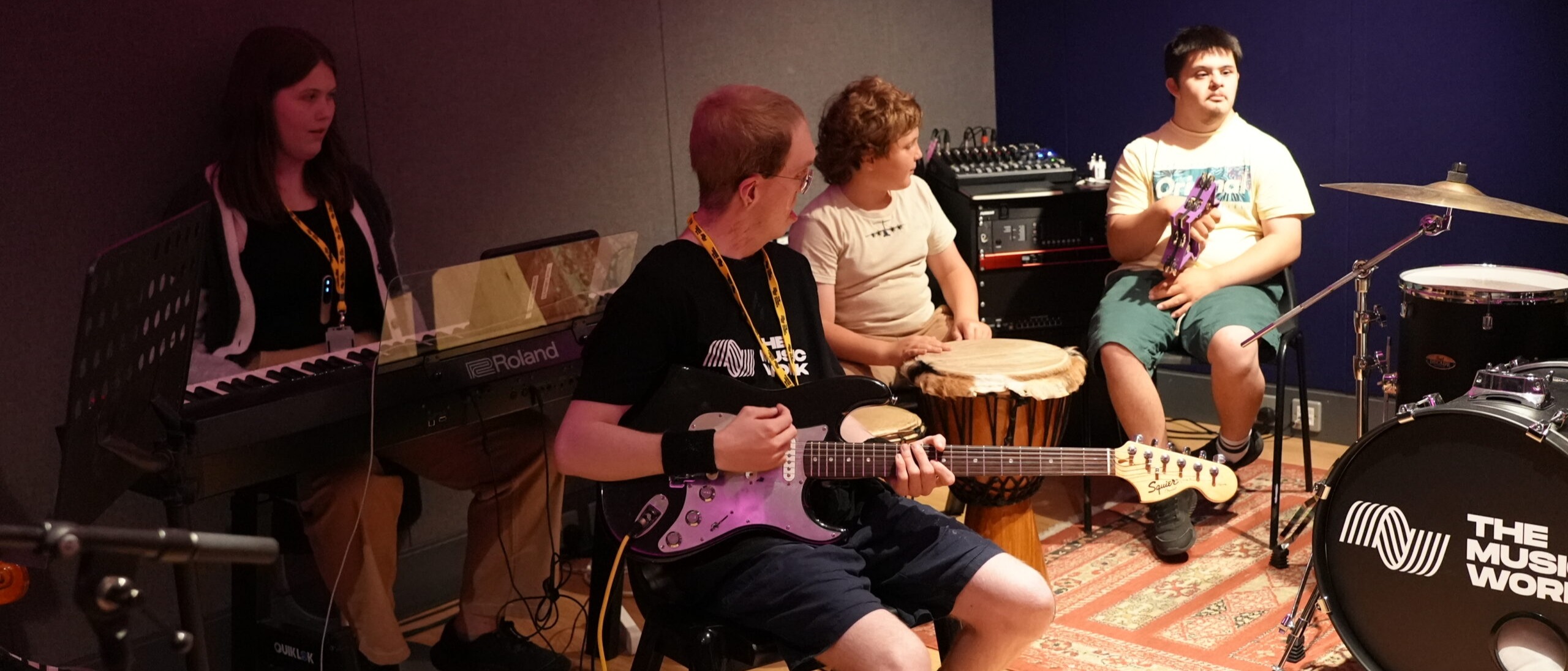 Group of young people making music on a range of instruments at The Music Works, Gloucester