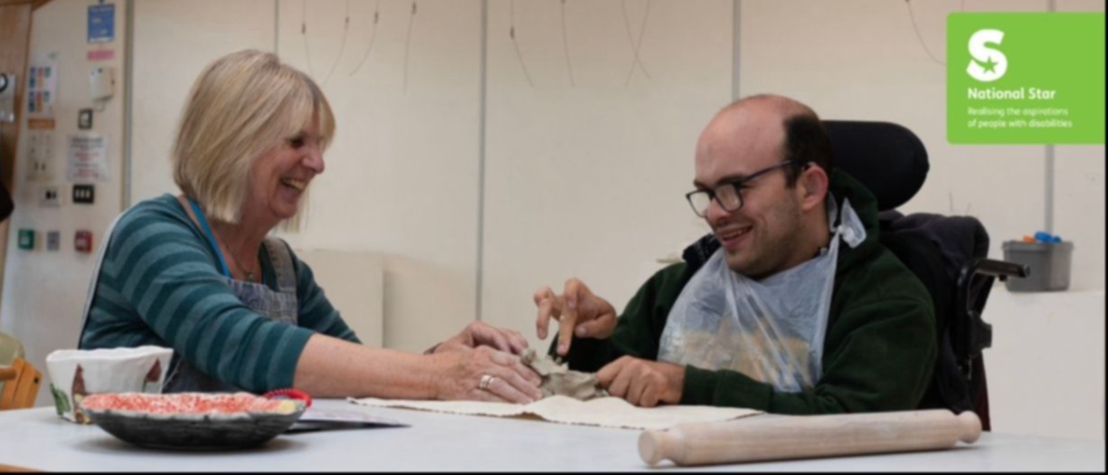 National Star colleague with a learner in a ceramics class