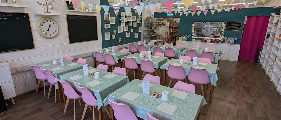 banner showing crafting space with tables and chairs